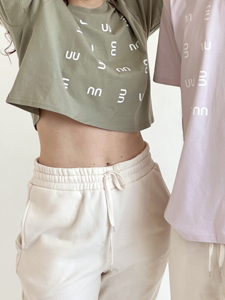 Ringo Studio Pistachio crop Tee with Ringo Studio monogram textured pattern paired with beige sweatpants for a casual chic look.